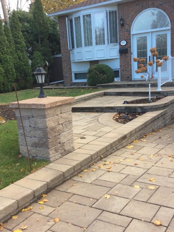 Front walkway with retaining wall and pillar